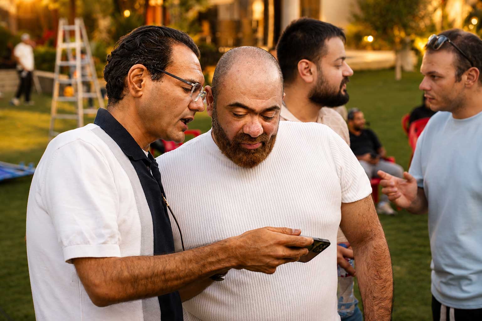 Directors reviewing footage on set — Lahza music video production by Strike Media